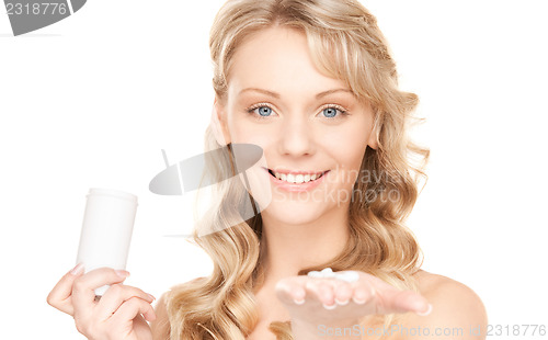 Image of young woman with pills