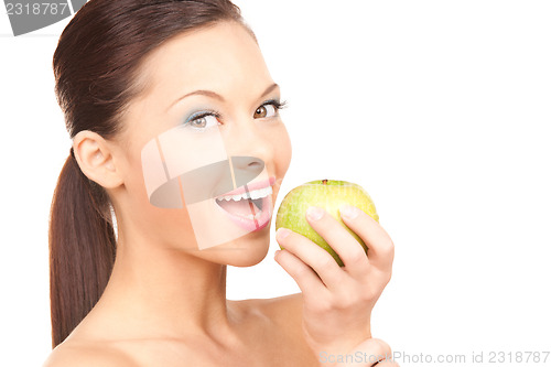 Image of young beautiful woman with green apple
