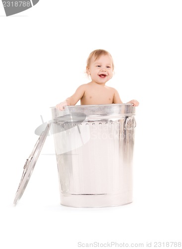 Image of baby in trash can