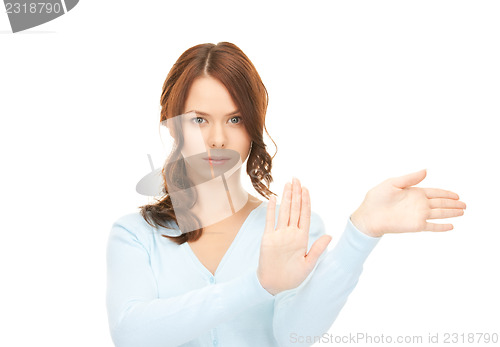 Image of businesswoman working with something imaginary