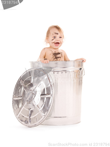 Image of baby in trash can