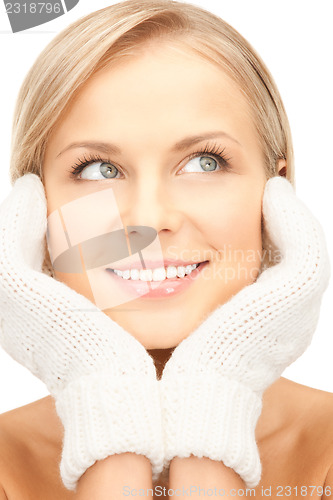 Image of beautiful woman in white mittens 