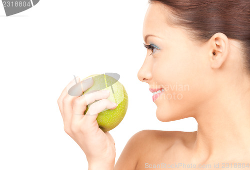 Image of young beautiful woman with green apple