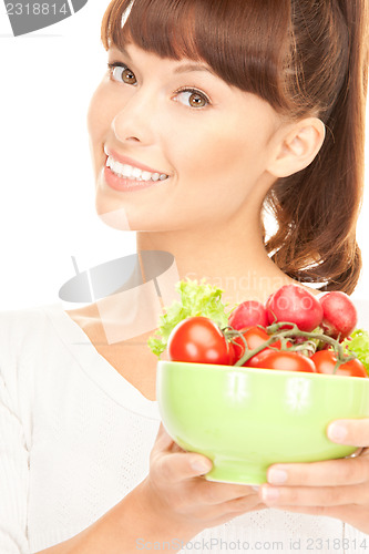 Image of beautiful housewife with vegetables