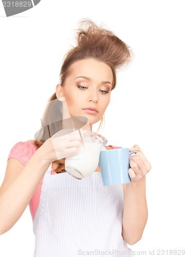 Image of housewife with milk and mug