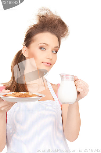 Image of housewife with milk and cookies