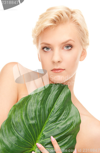Image of woman with green leaf