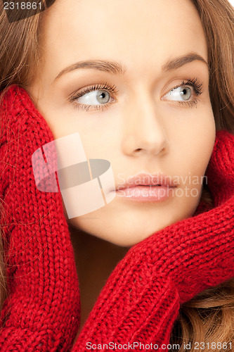Image of beautiful woman in red mittens 