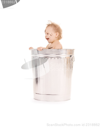 Image of baby in trash can