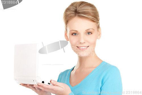 Image of happy woman with laptop computer