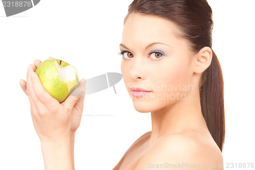 Image of young beautiful woman with green apple