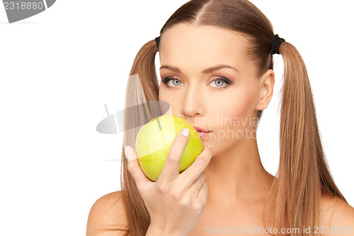 Image of young beautiful woman with green apple