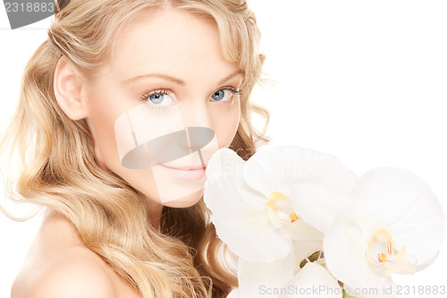 Image of beautiful woman with white flower