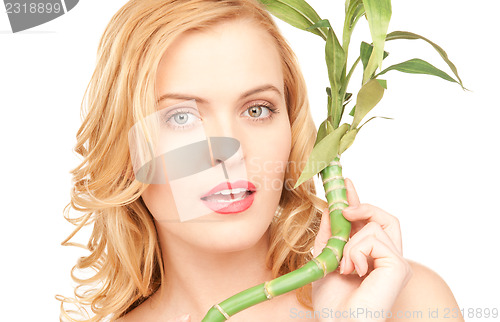 Image of woman with sprout over white