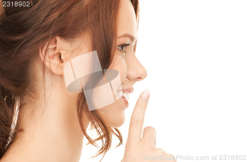 Image of finger on lips