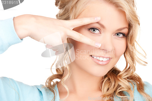 Image of woman showing hand with polished nails