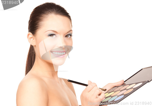 Image of lovely woman with palette and brush