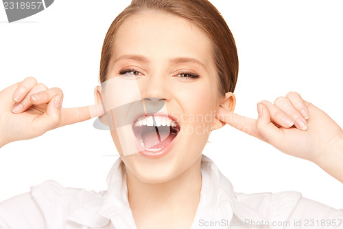 Image of woman with fingers in ears