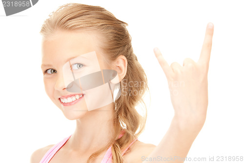 Image of happy girl showing devil horns gesture