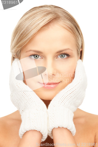 Image of beautiful woman in white mittens