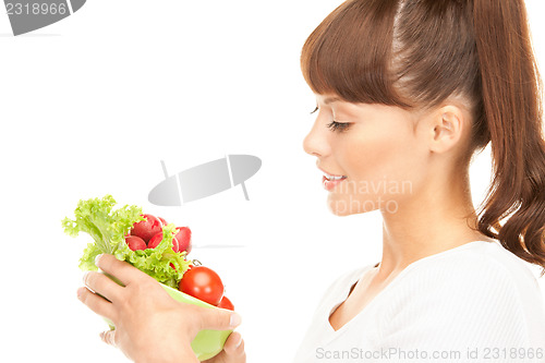 Image of beautiful housewife with vegetables