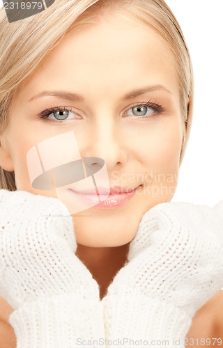 Image of beautiful woman in white mittens