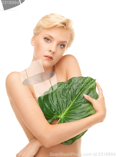 Image of woman with green leaf