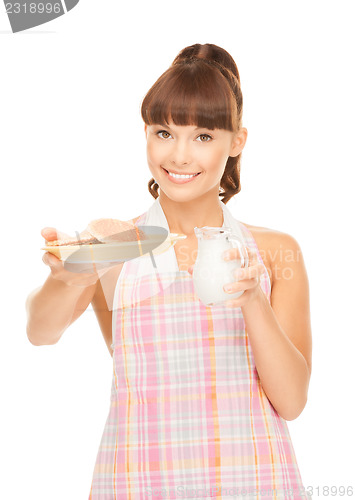 Image of housewife with milk and cookies