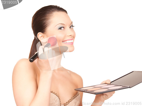 Image of lovely woman with palette and brush
