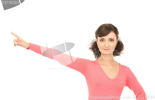 Image of attractive businesswoman pointing her finger