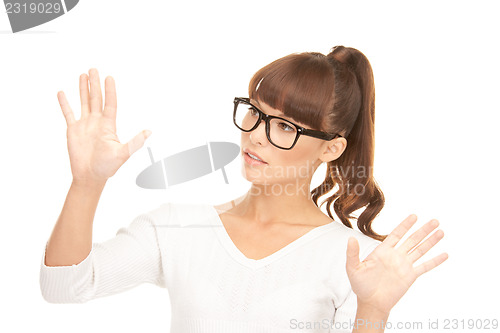 Image of businesswoman working with something imaginary