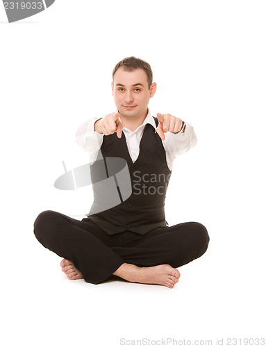 Image of businessman sitting in lotus pose