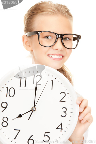 Image of picture of girl holding big clock