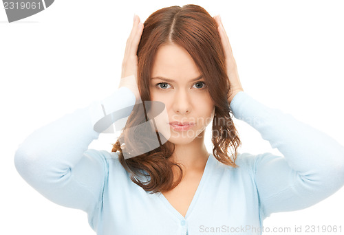 Image of woman with hands on ears