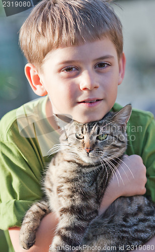 Image of Little boy with cat