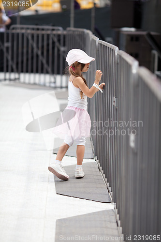 Image of Adorable little girl on the stadium