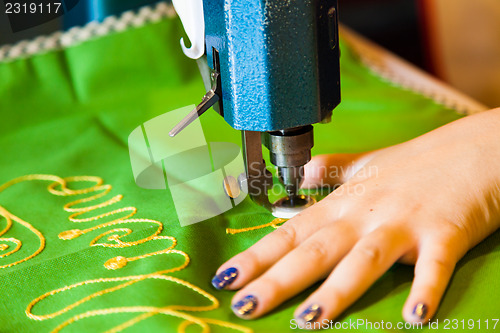 Image of Lady hand at sewing