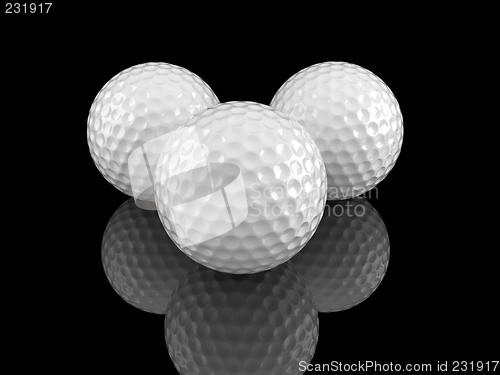 Image of White golf balls with ground reflection