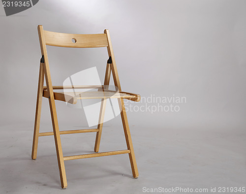 Image of A wood foldable chair