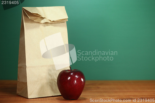 Image of School Lunch Sack Sitting on Teacher Desk