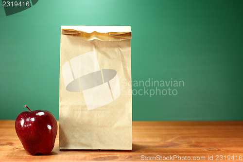 Image of School Lunch Sack Sitting on Teacher Desk