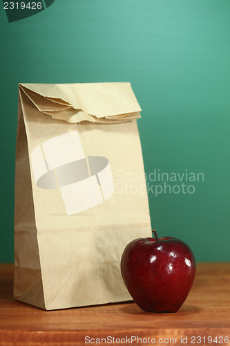 Image of School Lunch Sack Sitting on Teacher Desk