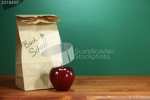Image of School Lunch Sack Sitting on Teacher Desk