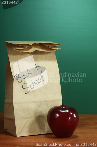 Image of School Lunch Sack Sitting on Teacher Desk