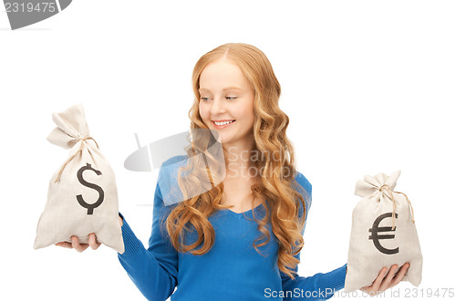 Image of woman with euro and dollar bags