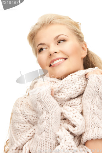 Image of beautiful woman in mittens  