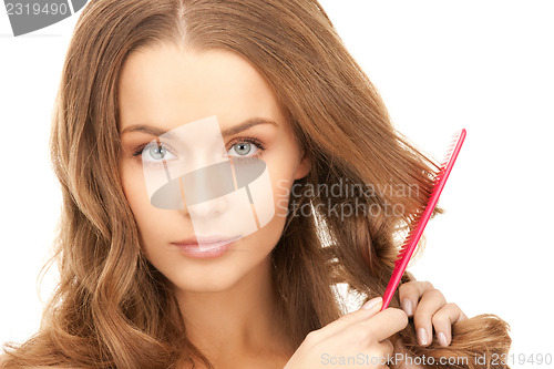 Image of beautiful woman with comb