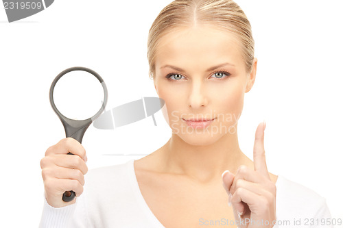 Image of woman with magnifying glass