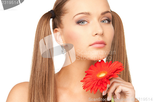 Image of lovely woman with red flower