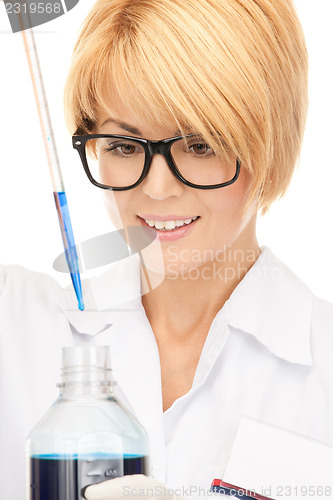 Image of lab worker holding up test tube